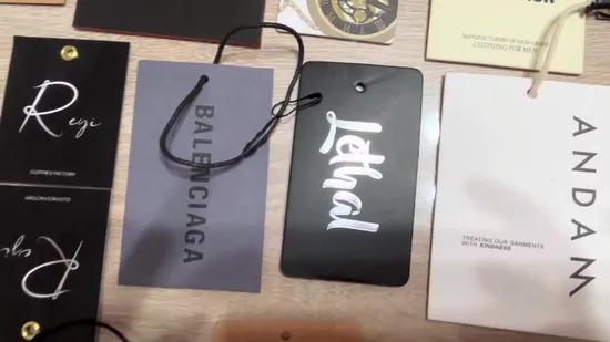China Custom Printed Cardboard Recycled Hang Tags Clothing New Models Design Paper Hand Tag for Shorts Bags Shoes
